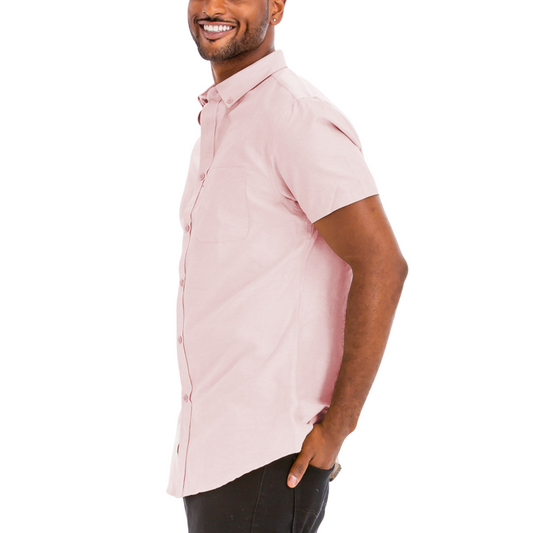 Man wearing a light pink short-sleeve shirt on a white background