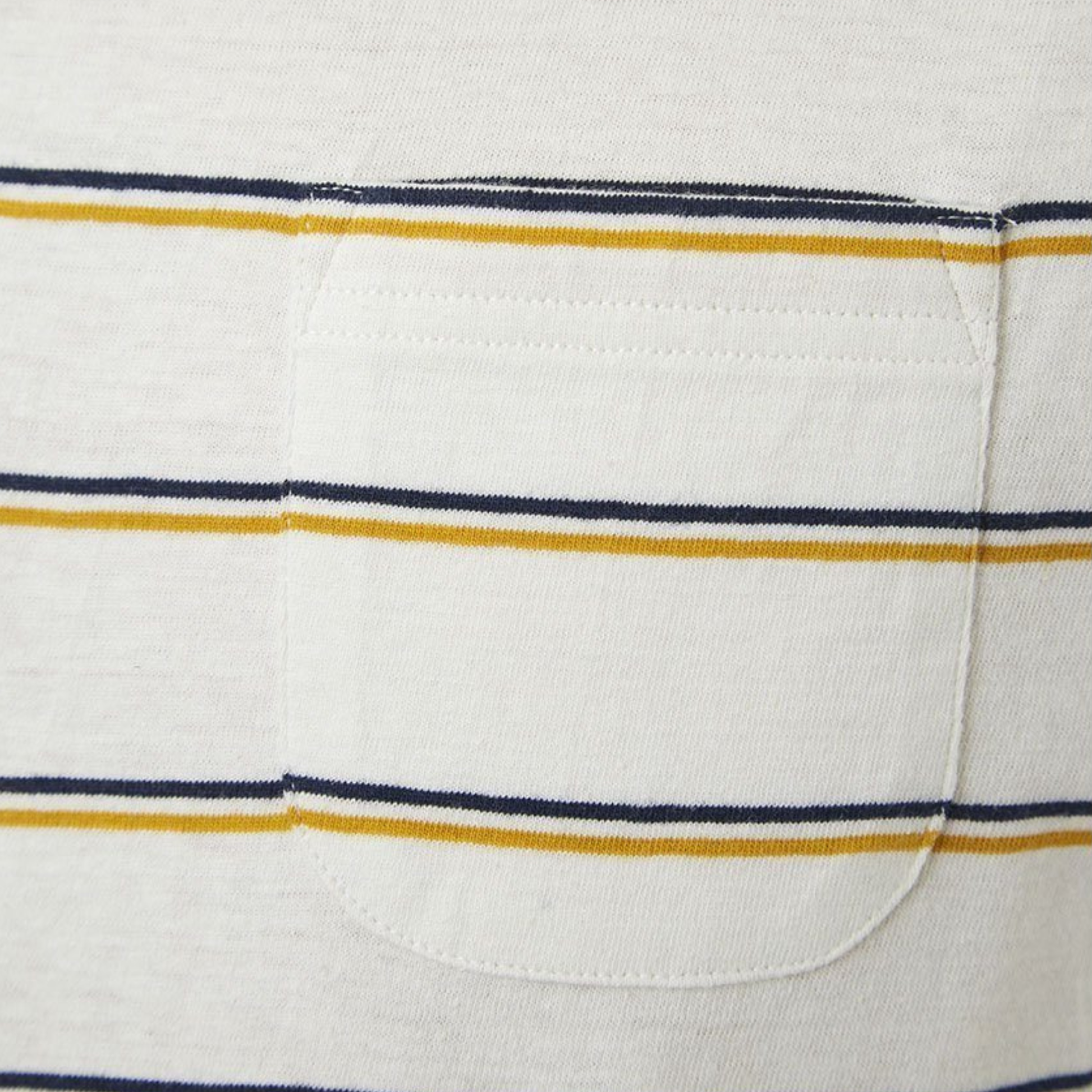 Close-up of a white fabric pocket with blue and yellow stripes.