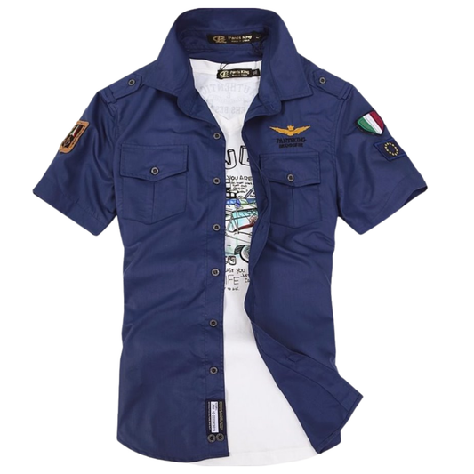 Blue short-sleeve shirt with patches on a white background
