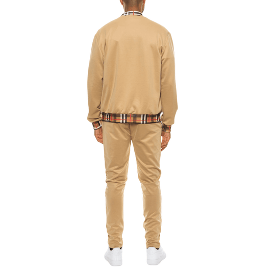 Men's two-piece Version Couture track suit with zip-up jacket and matching pants, featuring checkered detail on the collar, cuffs, and waistband.