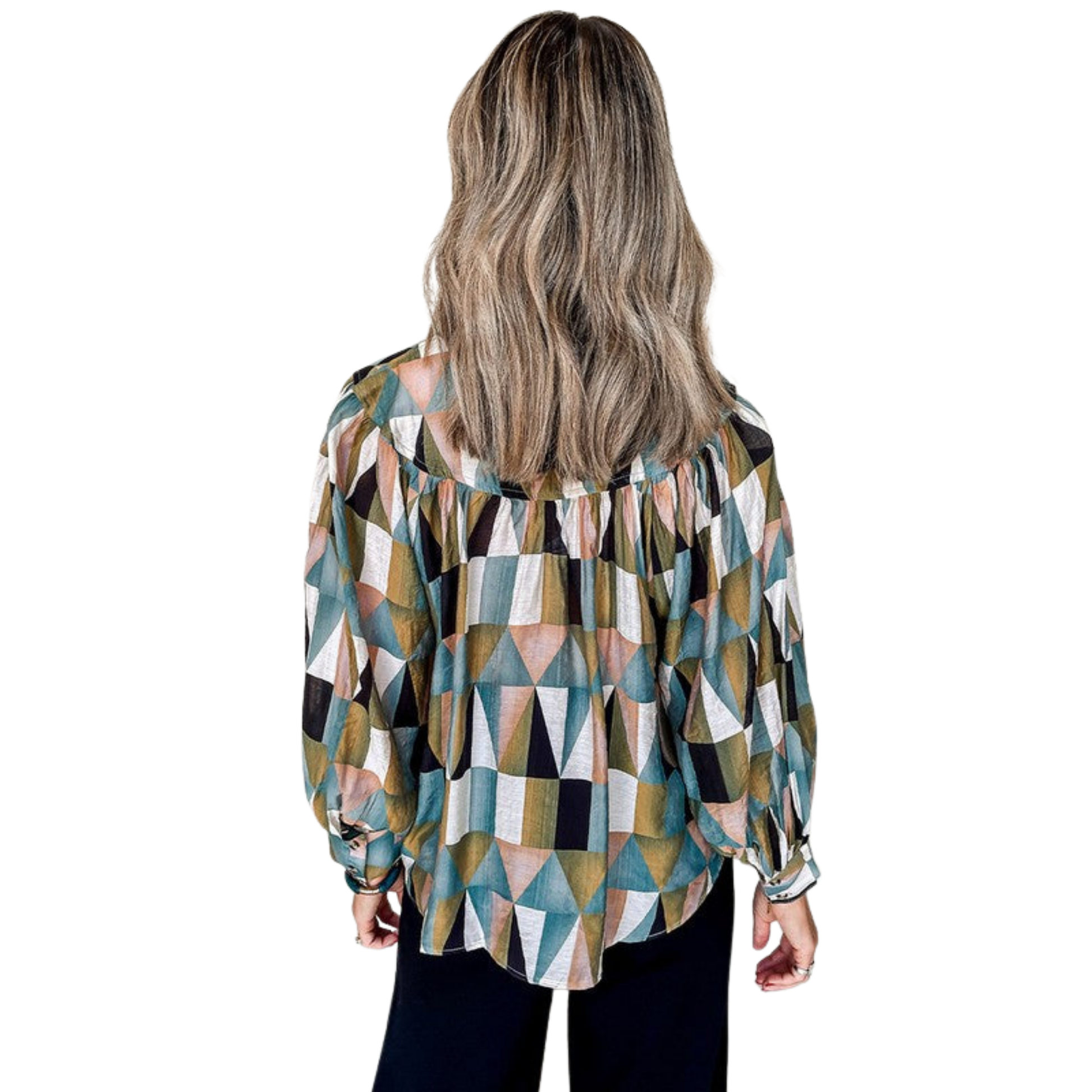 Woman wearing a geometric patterned blouse on a white background