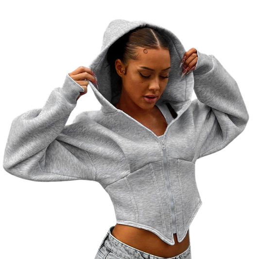 Woman wearing a gray cropped hoodie on a white background
