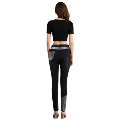 Woman wearing black leggings with gray accents on a white background