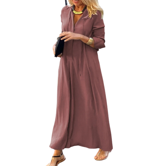 Woman wearing a long mauve dress on a white background