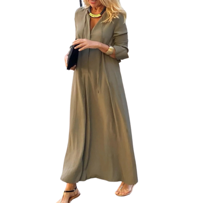 Woman wearing a long olive green dress on a white background