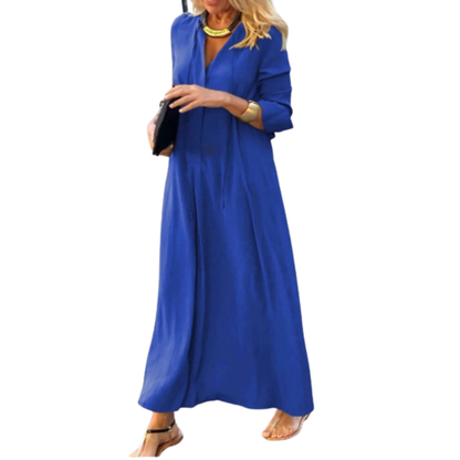 Woman wearing a blue long dress on a white background